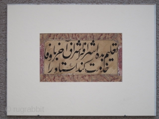 Ottoman calligraphic paper folio, possibly a qit'ah, written in Persian in nasta'liq script with a proverb, "Give to the noble one (sharif)... 
The size of the actual piece is apx. 9"x5". It  ...