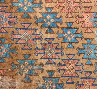 This is a colorful little symmetrically knotted piece that measures 48 x 30 inches.  It is complete, with original selvedges and ends.  It has a few dings and some wear,  ...