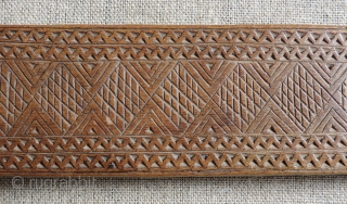 Albanian distaffs and other carved wooden weaving implements.  19th century. longest piece 37 x 4 inches.                