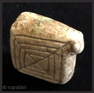 Carved and incised alabaster amulet.  19th century.  Bolivian Altiplano.  This type of fetish is called an illa (ee-ah). It was made in the shape of a generic domestic animal  ...