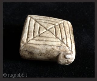 Carved and incised alabaster amulet.  19th century.  Bolivian Altiplano.  This type of fetish is called an illa (ee-ah). It was made in the shape of a generic domestic animal  ...