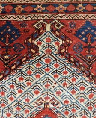 19th century Beshir prayer rug with a white ground mihrab that features clusters of stylized pomegranates. These prayer rugs are found in several different variants or groups as delineated by Ralph Kaffel  ...