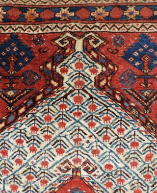 19th century Beshir prayer rug with a white ground mihrab that features clusters of stylized pomegranates. These prayer rugs are found in several different variants or groups as delineated by Ralph Kaffel  ...