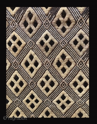 One panel of a two panel cut pile raffia cloth ceremonial dance skirt.  Beautifully made with an elegant surface and unusually balanced design.  This is an old piece with character.  ...