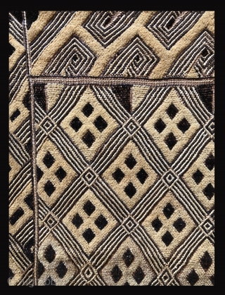 One panel of a two panel cut pile raffia cloth ceremonial dance skirt.  Beautifully made with an elegant surface and unusually balanced design.  This is an old piece with character.  ...