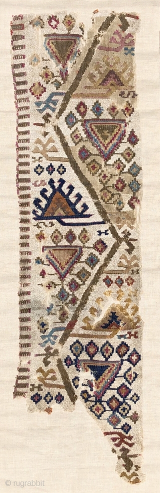 Antique Reyhanli kilim fragment.  Unusual two tone - mixed wool and cotton wefts used as an off-white field or ground color.  There is an animated, almost musical quality to the  ...