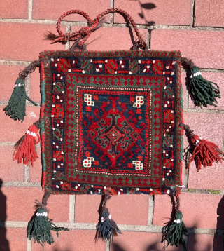 Mint condition, small,  double-sided Baluch bag.  Full pile on both faces of the bag. All dyes natural.  Brilliant reds and greens.  Size: 14 x 14 inches without tassels.  ...