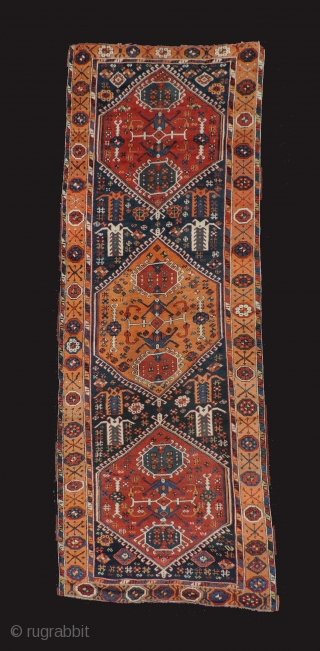 East Anatolian rug with medallions. 1st half of the 19th century. Three serrated medallions on a blue field. Missing minor borders top and bottom. Original selvedges.  Beautiful even weave.   