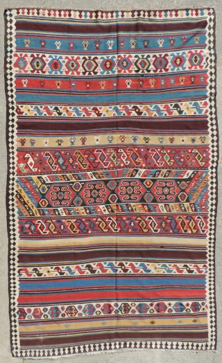 Azerbaijan Kilim. This is a 19th century weaving that has an unusual collection of designs and a good variety of clear, pleasing, natural dyed colors. It is in very good condition and  ...
