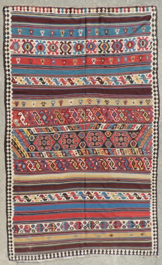 Azerbaijan Kilim. This is a 19th century weaving that has an unusual collection of designs and a good variety of clear, pleasing, natural dyed colors. It is in very good condition and  ...