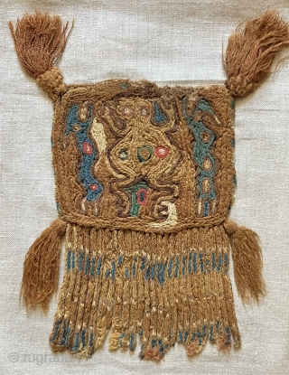Rare and primitive Pre-Columbian textile pendants. Researching the literature has yielded less than seven of this kind of textile and each example is unique as regards iconographic content.  They are indeed  ...