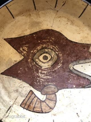 Pre-Columbian shallow bowl with stylized llama head on ivory colored background. Nasca Culture, Peru. AD. 200 to 600. Size: 10 inches in diameter x 3 inches deep. The Llama head on this  ...
