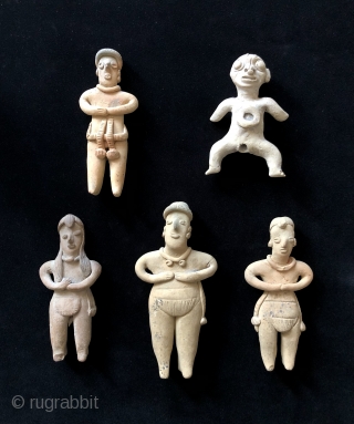 Little People. Five Colima clay figures. B.C. 100 - A.D. 200.  Charming ancient beings from the West Mexican Colima Culture.  Tallest figure is 6 inches high.  Various figures display  ...
