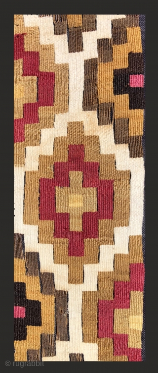 Very beautifully woven Pre-Columbian slit tapestry strip.  Chimu Culture, Peru.  A.D. 1000 - 1400.  The textile has been sewn to a black backing cloth and attached to a frame  ...