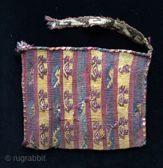 Captivating little Pre-Columbian bag.  Very unusual style with edge finishes like some provincial Nasca/Wari textiles.  A.D. 600 - 1200.  Stylized zoomorphic figures travel in rows across the width of  ...
