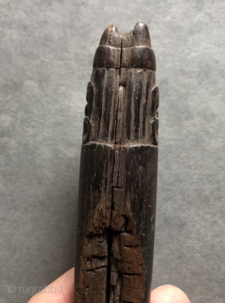 Carved Wari period figure with a four-cornered hat. This beautifully detailed, small Pre-Columbian wood carving was probably a stopper for some kind of container either wood, stone or ceramic.  Such a  ...