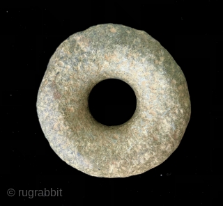 Ancient Andean stone implements.  A.D. 500- 1400's.  The stone discs (Andean Bagels) were used as mace heads or hammer stones when coupled with a wooden handle inserted through the center.  ...