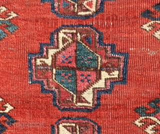  This small Middle Amu Daria Turkmen carpet is of unknown tribal origin, but has the look of a Salor Turkmen weaving. The spacing of the guls is generous and lends a  ...