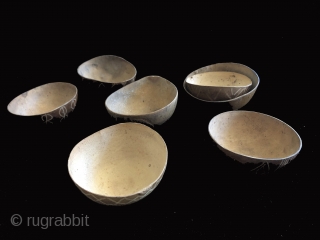 Seven incised gourd bowls. I bought these years ago at a show in New York (I think?) as shaman's cups for the ritual drinking of intoxicants.  I cannot recall anything else  ...