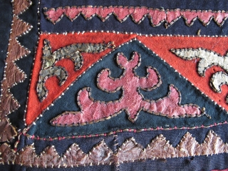 Central Asian Kirghiz small Applique: leather, wool, some metal thread and perhaps cotton on a block-printed back, silk stitching. 24" x 16"           