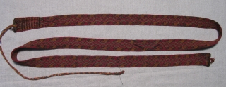 Pre-Columbian Sash, Peru, S. Coast, AD 900 - 1400.  Size: 1.25 inches x 74 inches.  Beautiful color,centipede-like design and very nicely woven.  Excellent condition.      