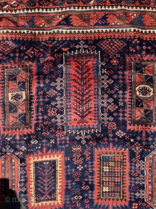 Excellent 19th century Baluch Yakub Khani Main Carpet. Great colors! All natural dyes. Full, silky pile throughout. Complete with sides and ends intact. Beautiful deep indigo field with lots of camel hair  ...