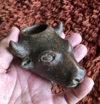 This unusual small cow head shaped ceramic is probably a variant type of libation vessel associated with the Animal Increase Rite.  I have not seen anything quite like it before.   ...