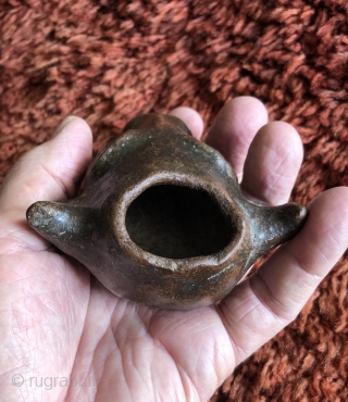 This unusual small cow head shaped ceramic is probably a variant type of libation vessel associated with the Animal Increase Rite.  I have not seen anything quite like it before.   ...