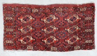 Turkmen nine gul juval.  Middle Amu Daria region. Good age, good color, good wool, good pile, good price.  Missing sides and ends.  Size: 47.5 x 24 inches.   