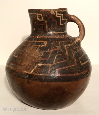 Three large ceramic pitcher shaped vessels from the ancient Americas.  These pots are from the Altiplano region of Bolivia and date to between A.D. 600 - 1400.  Each is from  ...