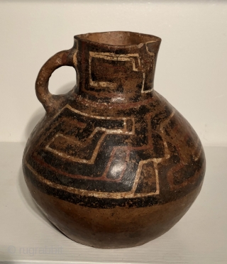 Three large ceramic pitcher shaped vessels from the ancient Americas.  These pots are from the Altiplano region of Bolivia and date to between A.D. 600 - 1400.  Each is from  ...