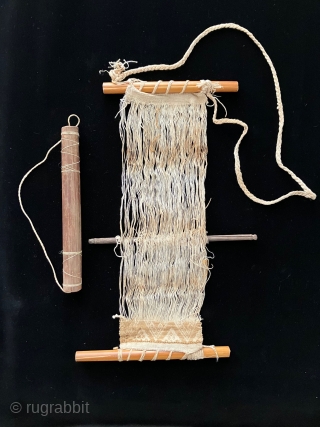 Tools of the trade.  Pre-Columbian weaving tools including a loom with partly completed weaving, spindles, llama bone weft packing implements and weaving swords.  All more than 600 years old.   ...