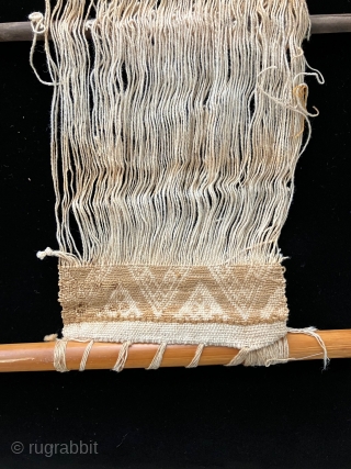 Tools of the trade.  Pre-Columbian weaving tools including a loom with partly completed weaving, spindles, llama bone weft packing implements and weaving swords.  All more than 600 years old.   ...