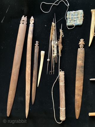 Tools of the trade.  Pre-Columbian weaving tools including a loom with partly completed weaving, spindles, llama bone weft packing implements and weaving swords.  All more than 600 years old.   ...