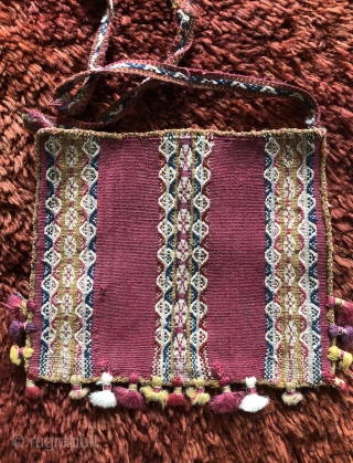 Three Andean coca bags woven by the indigenous Aymara people. The Aymara are a pastoral group of indians that live in the high Altiplano region of Bolivia at about 12,500 feet above  ...