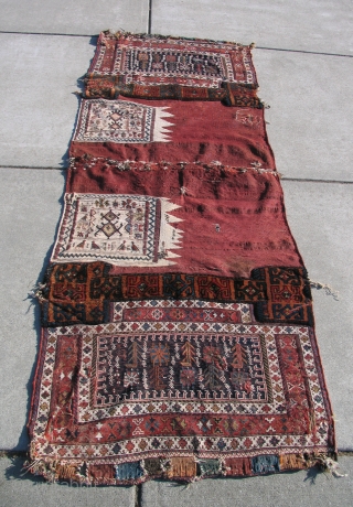 Baktiari Pack Bag (opened out).  Old 19th century nomad bags battered, but with character.  Reasonable.                