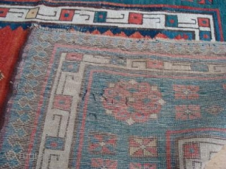 Such a beautiful rug. I believe it to be early nineteenth century. It has a fine weave with cotton wefts. 2.23m x 1.03m. Unrestored, some low areas and sides are missing. Now  ...