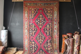 19th century Karabagh Kelleh with cochineal ground colour and marvelously abrashed light blue border. 7' x 20'6" In low pile with minor areas of repiling. Beautiful carpet!      