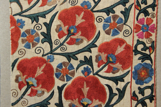 Mid 19th century Nurata Suzani fragment, beautifully mounted.
39 x 95cm / 1'3" x 3'1"                   