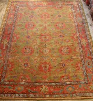 Antique Oushak 309 x 403cm / 10'2" x 13'3" with gorgeous grass green background. Showing wear.                 