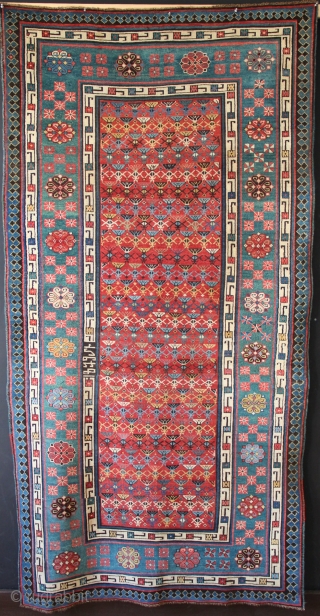 Talish area Caucasian rug dated 1879. In showroom condition (ie minor restoration) there is even low pile allover, and warm, attractive colour, particularly the abrashed green border. 4'1" x 7'10"   