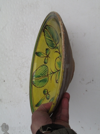 Spanish or Italian 19th.century red earthenware ceramic shallow bowl, glazed upper surface with quartered clover-leaf pattern in yellow, green and brown, has a very resonant ring when tapped suggesting fired at a  ...