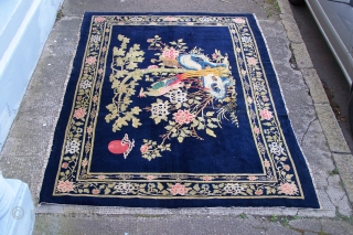 Chinese Carpet, (main image is from the back) early 20th.century, has some synthetic colours and (I count) five patch repairs, otherwise pile in reasonable condition, replaced side selvages, 180 x 276cm  