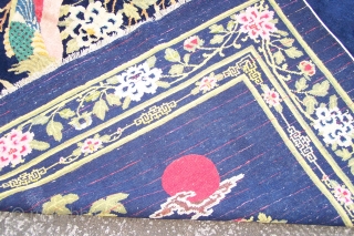 Chinese Carpet, (main image is from the back) early 20th.century, has some synthetic colours and (I count) five patch repairs, otherwise pile in reasonable condition, replaced side selvages, 180 x 276cm  