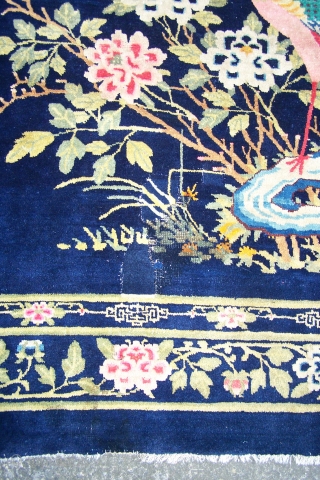 Chinese Carpet, (main image is from the back) early 20th.century, has some synthetic colours and (I count) five patch repairs, otherwise pile in reasonable condition, replaced side selvages, 180 x 276cm  