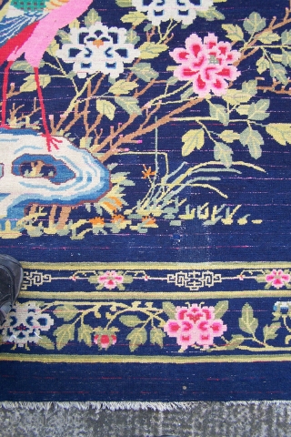 Chinese Carpet, (main image is from the back) early 20th.century, has some synthetic colours and (I count) five patch repairs, otherwise pile in reasonable condition, replaced side selvages, 180 x 276cm  