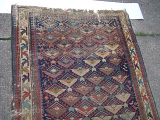 Shirvan runner, indigo field with flowerhead lattice and numerous figurative and animal motifs, diagonal leaf main border flanked by reciprocal 'dog-tooth' guards, c1900, contains synthetic colours but nice 'old style' weave, 290  ...