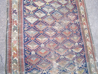Shirvan runner, indigo field with flowerhead lattice and numerous figurative and animal motifs, diagonal leaf main border flanked by reciprocal 'dog-tooth' guards, c1900, contains synthetic colours but nice 'old style' weave, 290  ...