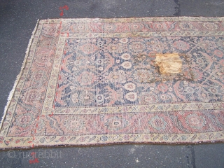 A fragmentary North-West Persian carpet, the surviving sections of what must have been an impressive pair of large pattern herati carpets. Although in a reworked state, this carpet still retains great presence  ...