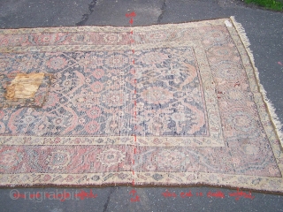 A fragmentary North-West Persian carpet, the surviving sections of what must have been an impressive pair of large pattern herati carpets. Although in a reworked state, this carpet still retains great presence  ...